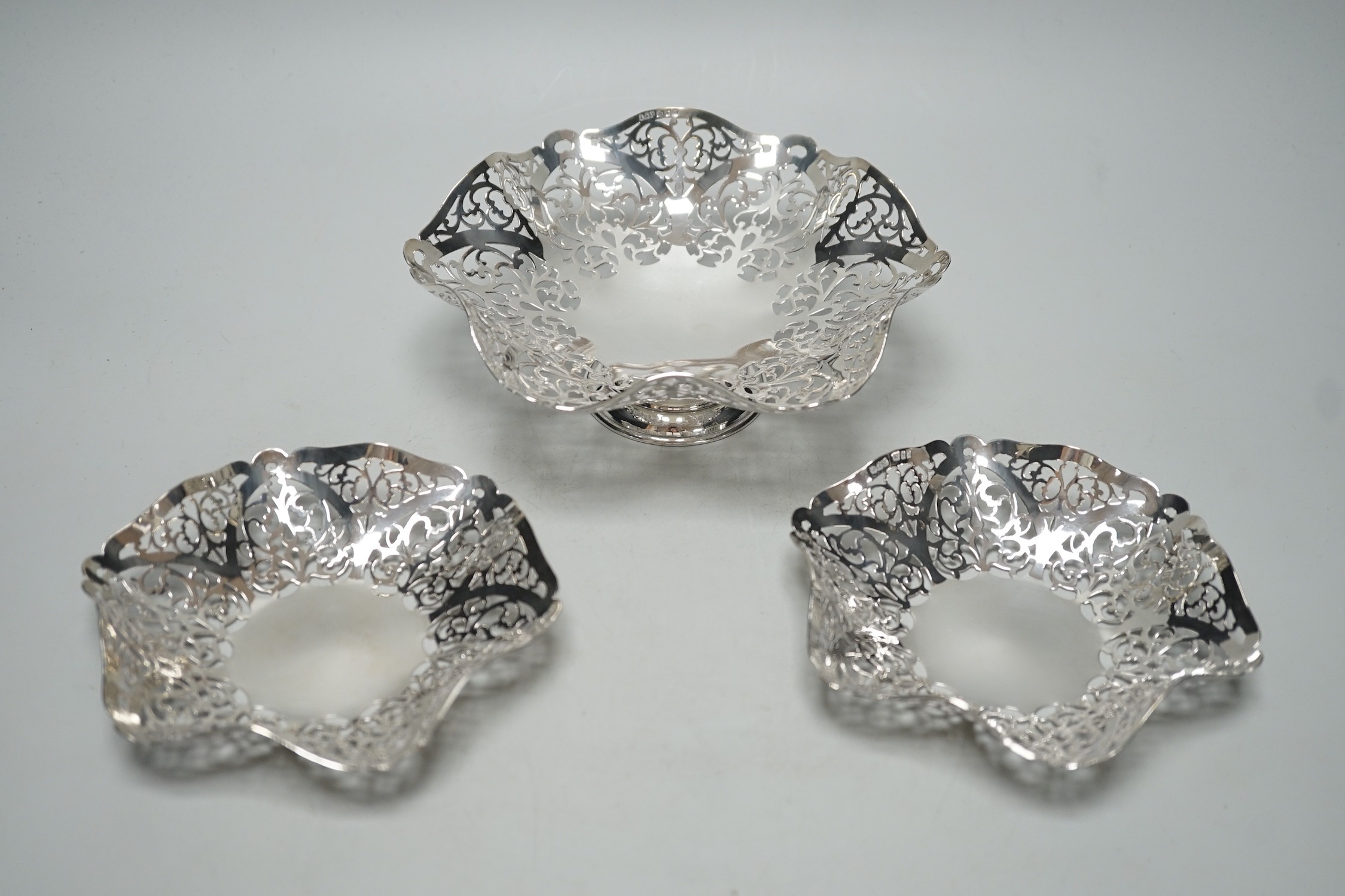 A modern suite of three Elizabeth II graduated pierced silver bonbon dishes, A. Taite & Sons Ltd, London, 1961, largest diameter 16.5cm, 11.9oz.